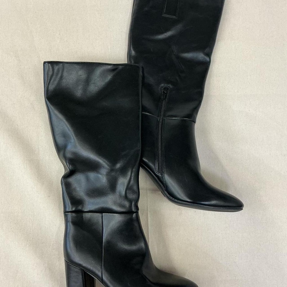 Classic black knee-high heeled boots